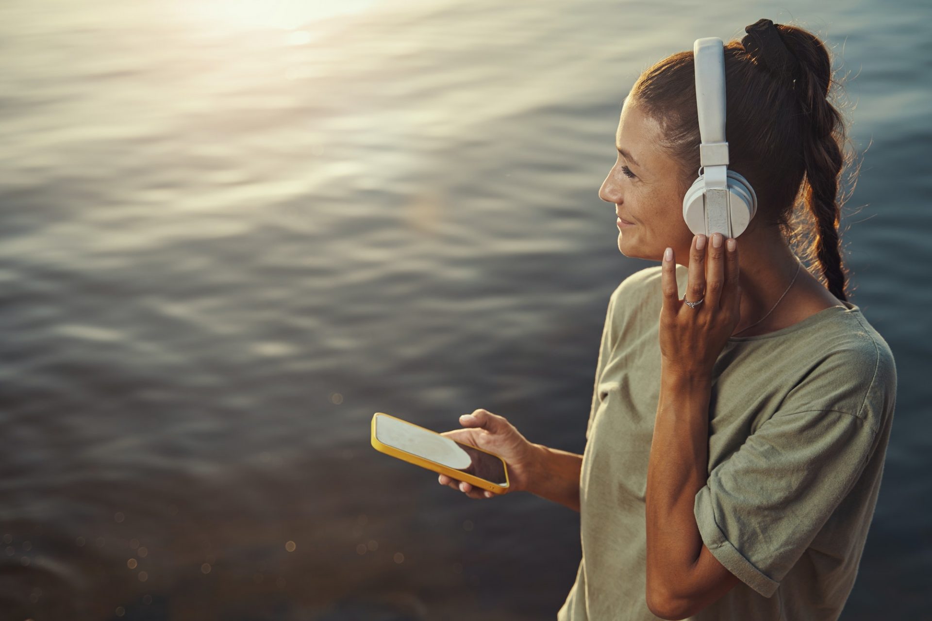 Positive woman listening to a good song on vacation