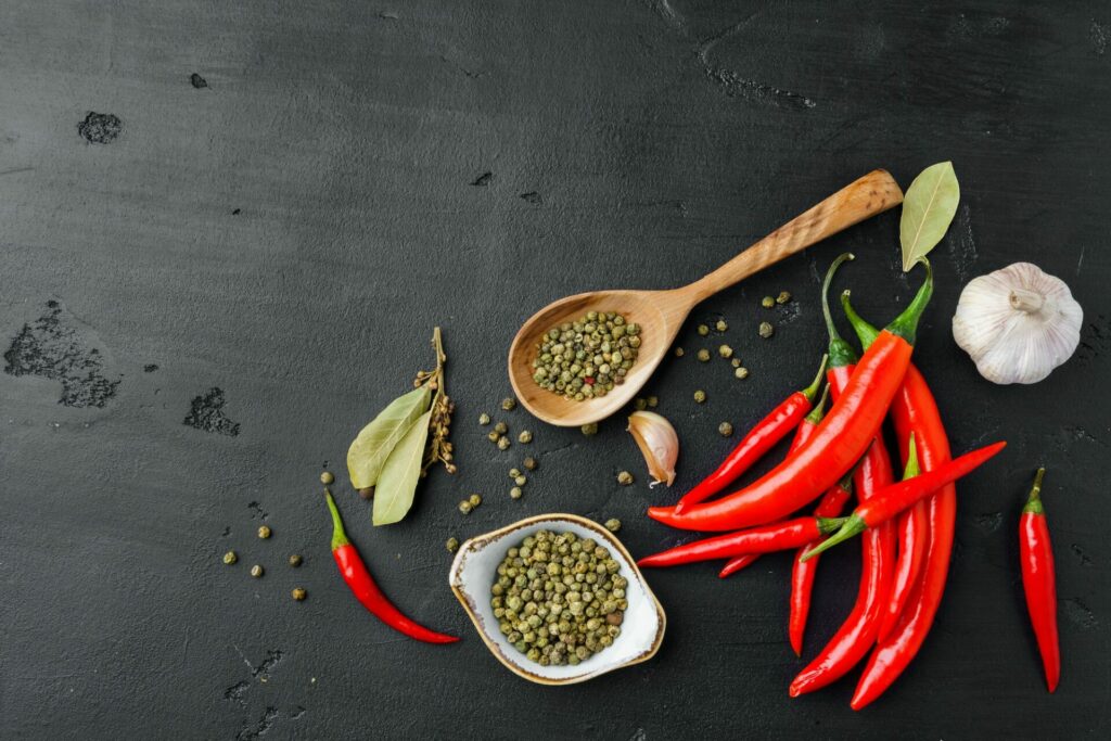 Flat lay composition with chili peppers and spices