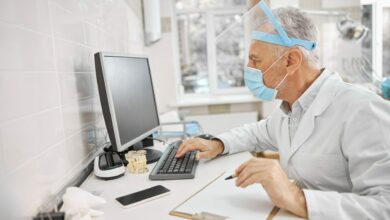 Busy healthcare professional looking at a computer screen