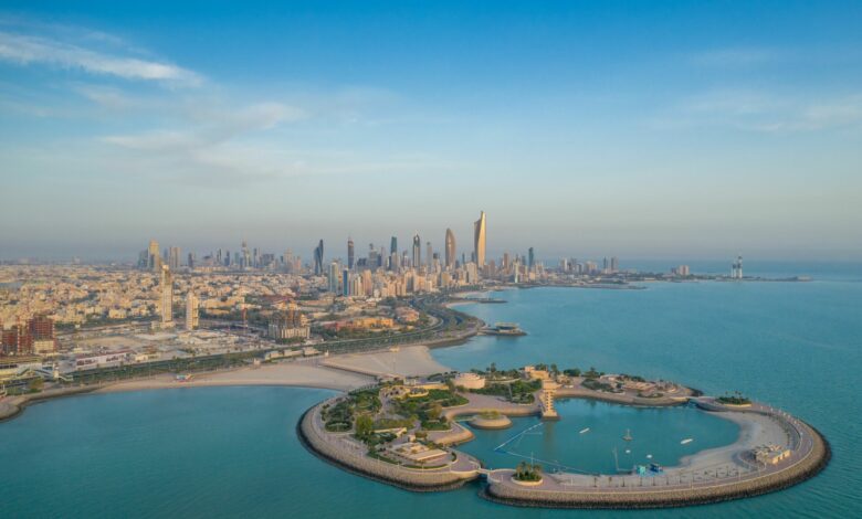 High-angle shot of The Green Island with a skyline of the city of Kuwait in the background