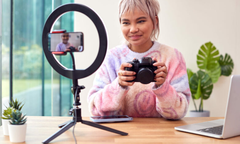 Female Vlogger Recording Camera Tutorial Video At Home With Mobile Phone