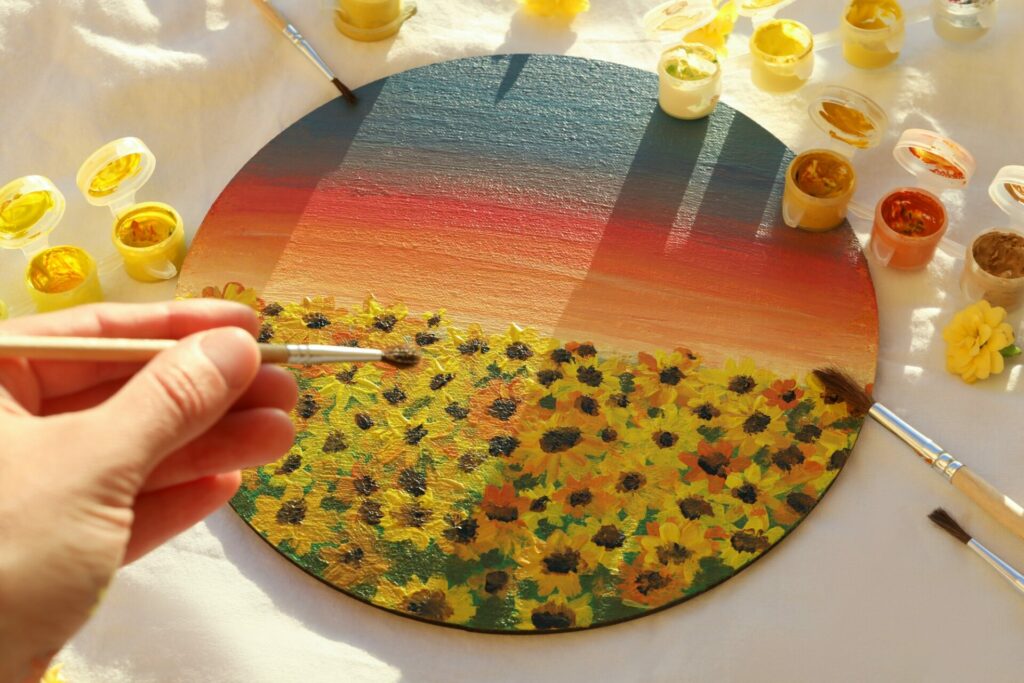 Concept of drawing, woman draw a painting with sunflowers