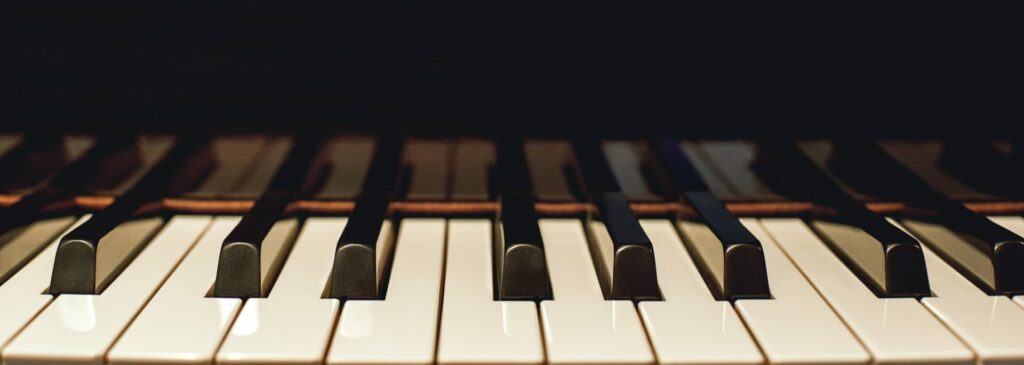 Learn how to play piano. Close up view of black and white piano keys. Musical instrument