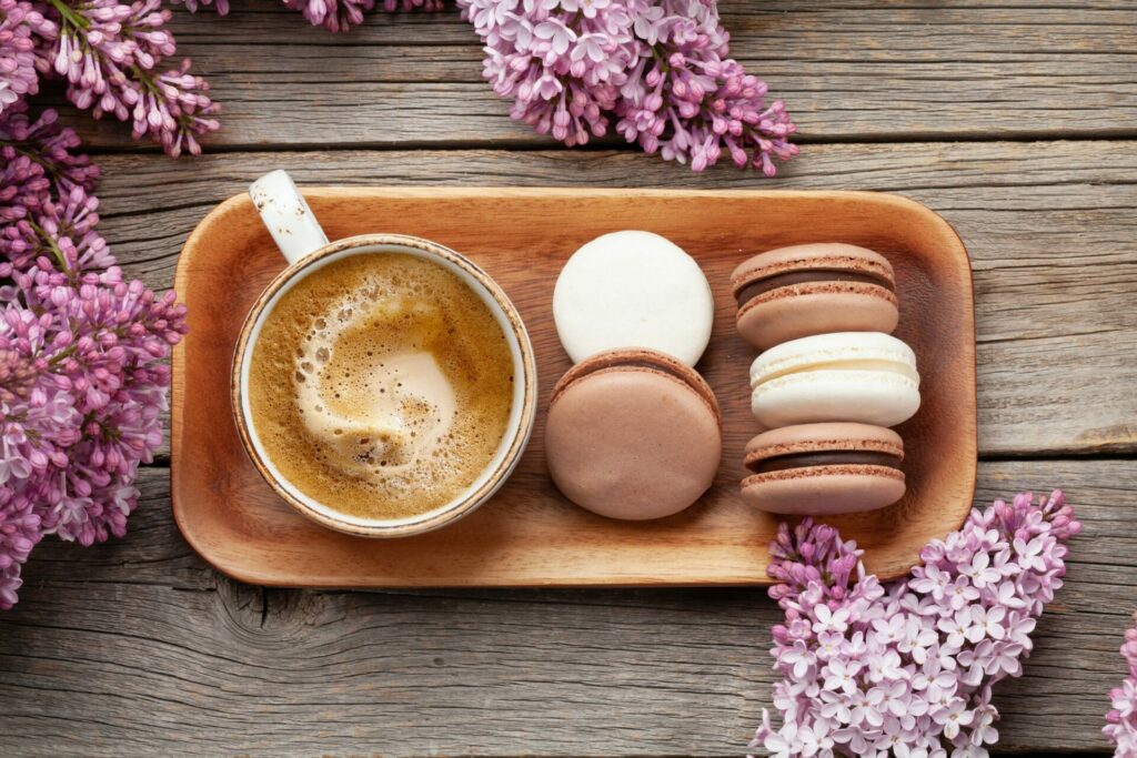 Wooden design coffee table with coffee and macaroons