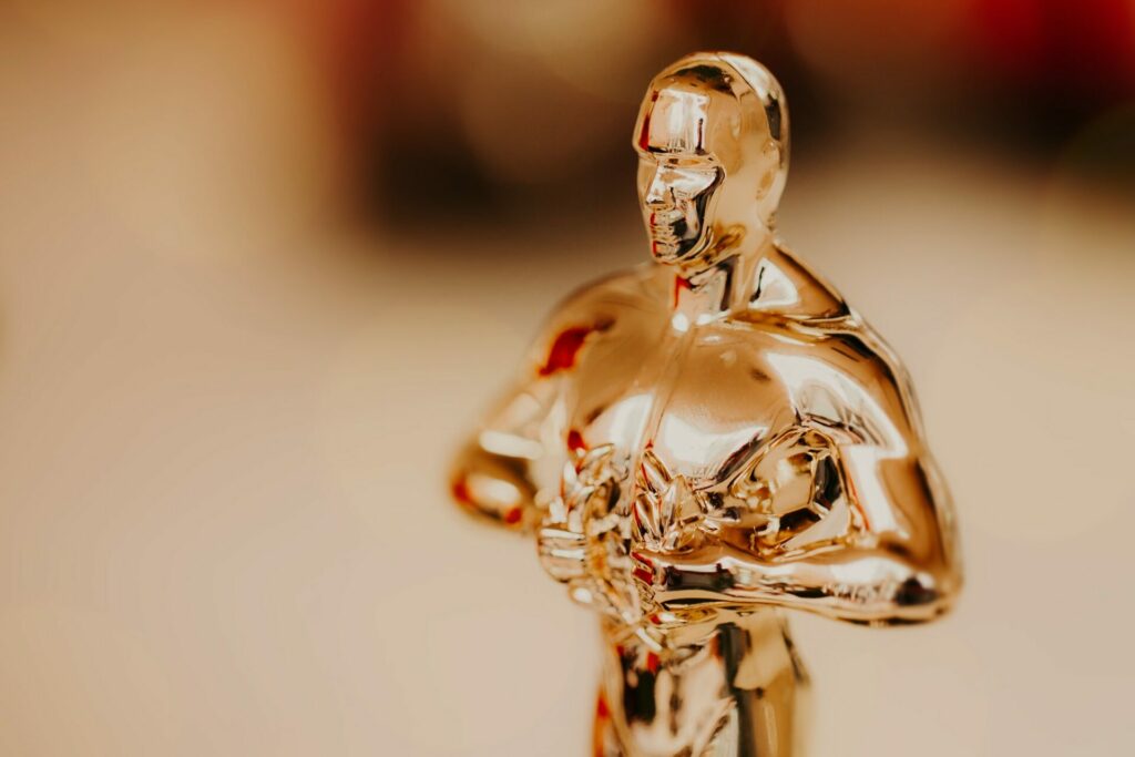 Nomination and Oscar reward concept. Golden statue for victory and success