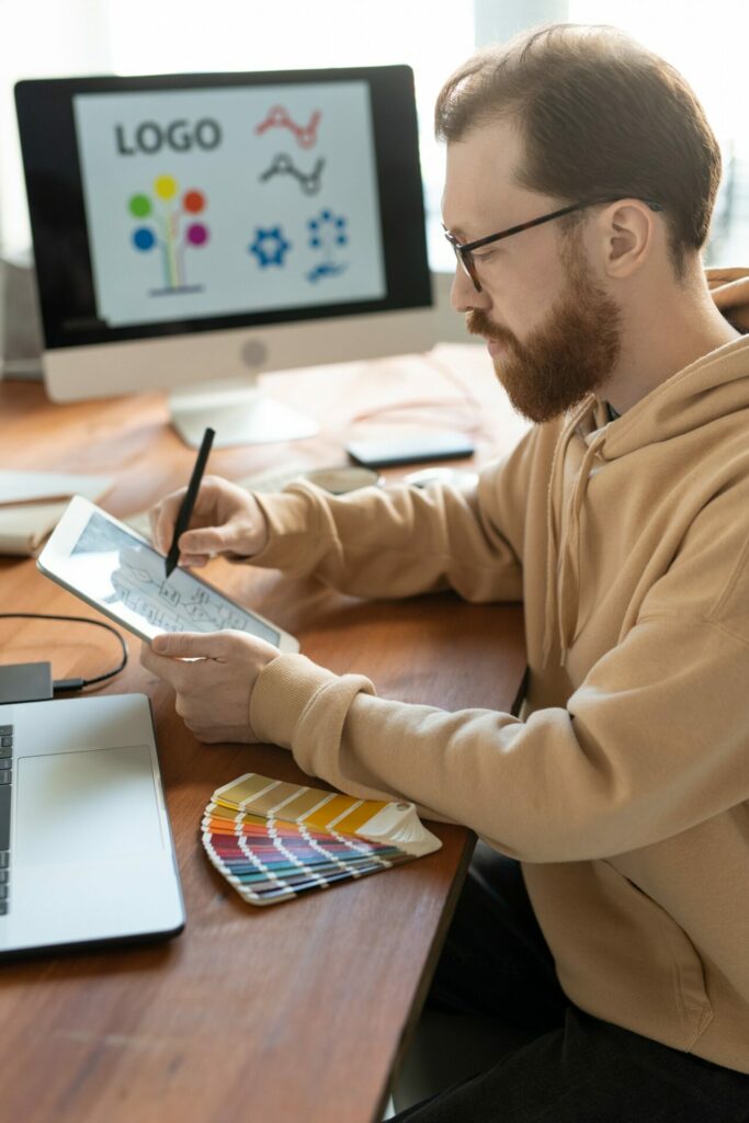 Man working on brand design as part of his digital marketing career 