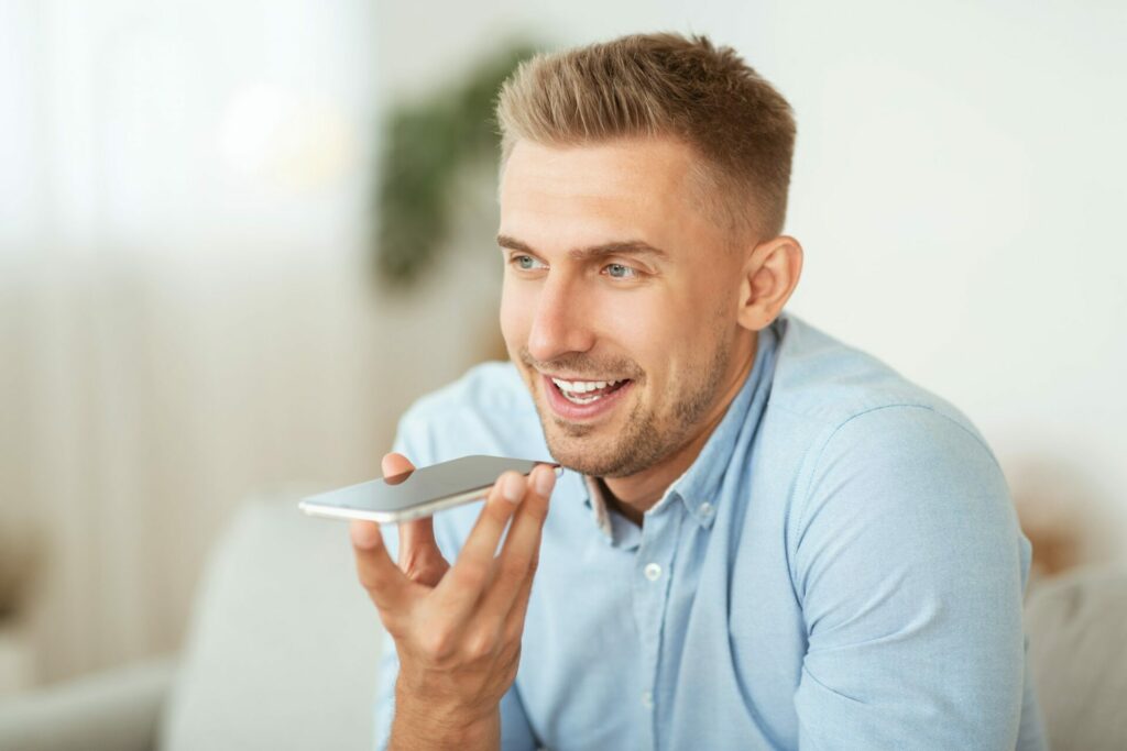 Young man using voicemail on his android phone