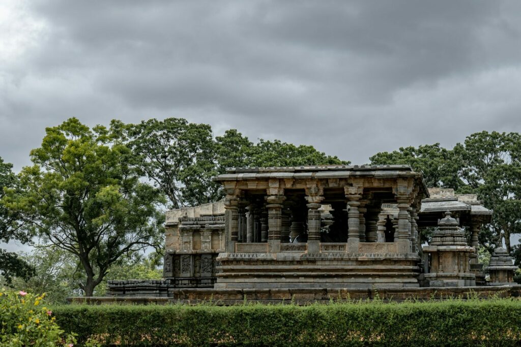 Ancient temple against a cloudy sky in Karnataka, India